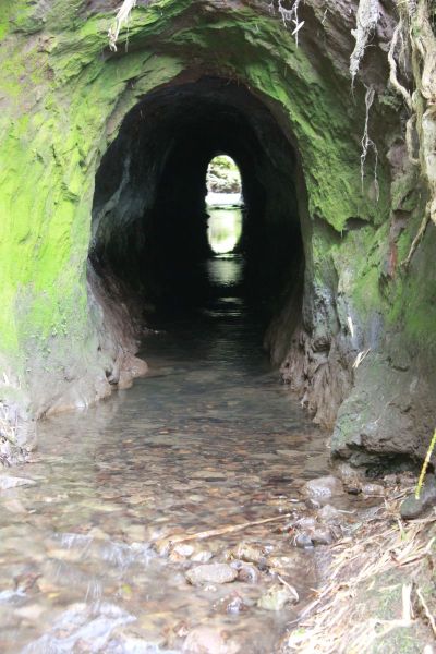 Tunnel Above Waterfall