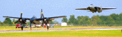 F-14 Tomcat landing behind other aircraft